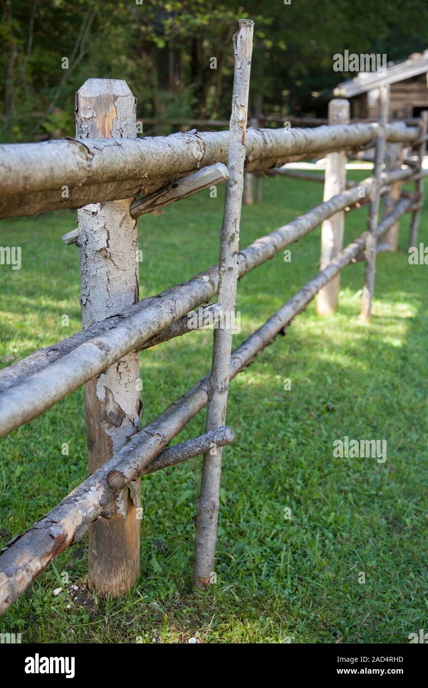 Old weathered wooden fence made with branches Stock Photo Alamy
