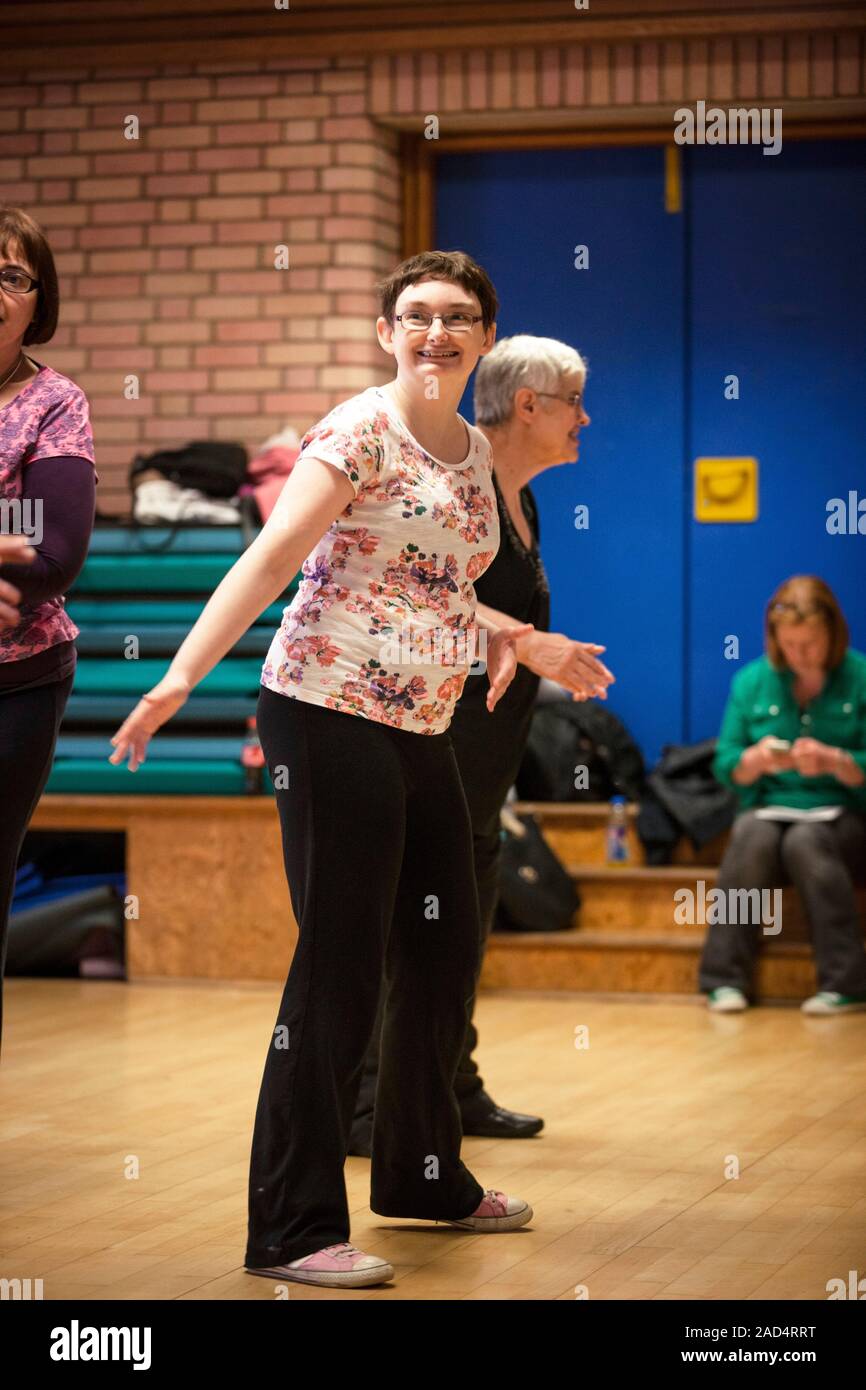 Exercise class for disabled people. Group of people with physical and