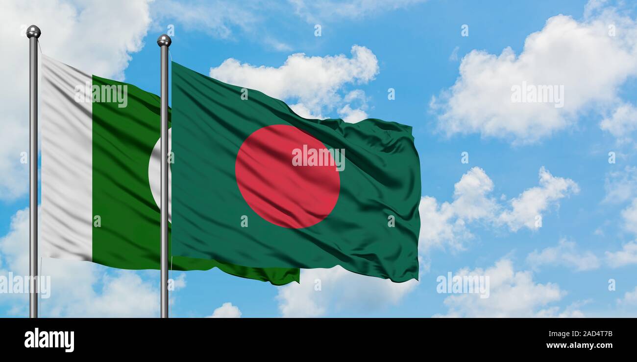 Pakistan and Bangladesh flag waving in the wind against white cloudy blue sky together. Diplomacy concept, international relations. Stock Photo