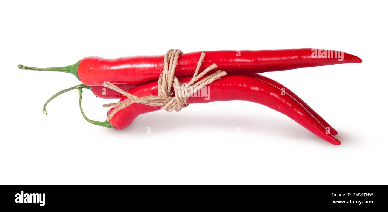 Three red chili peppers tied with a rope reversed Stock Photo