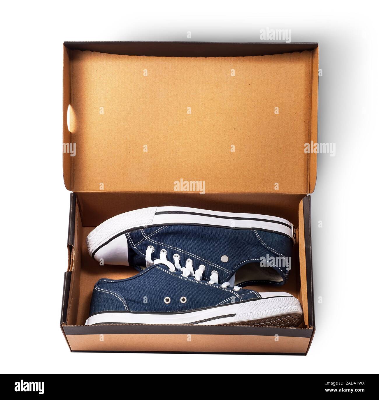 Dark blue sports shoes inside cardboard box Stock Photo