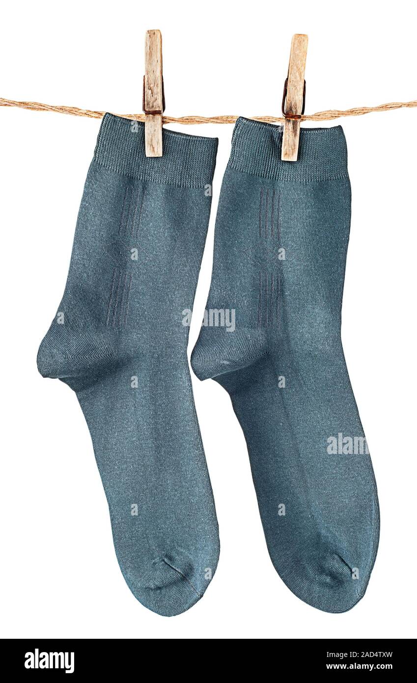 Dark blue socks on rope with clothespins Stock Photo