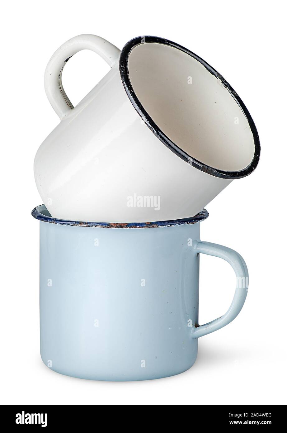 Two old enameled mugs on each other Stock Photo