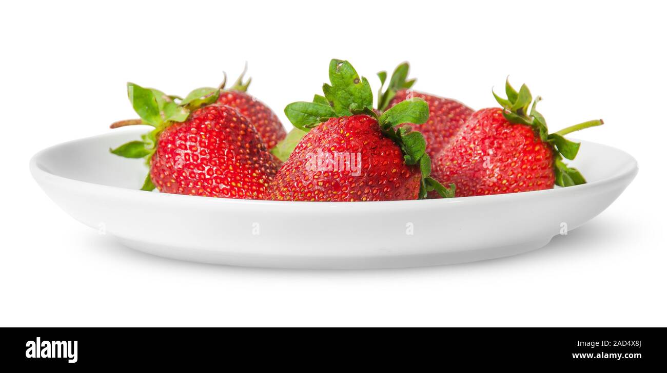 Several pieces of strawberry on white plate Stock Photo