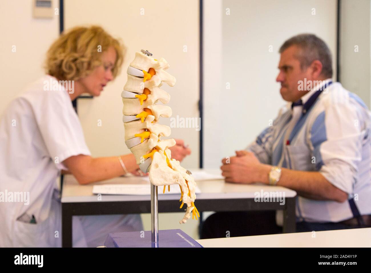 A patient with ankylosing spondylitis in consultation with a medical ...