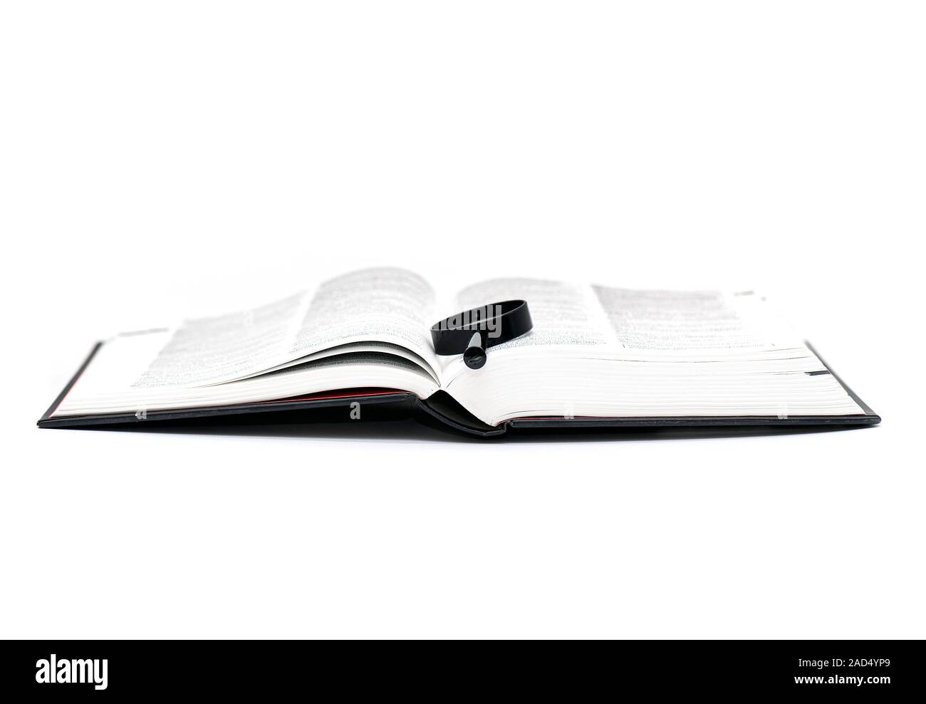Open Book with Magnifier isolate on white Background Stock Photo