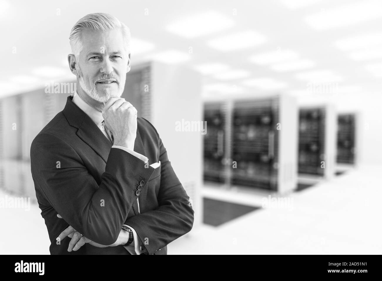 Senior Businessman in server room Stock Photo