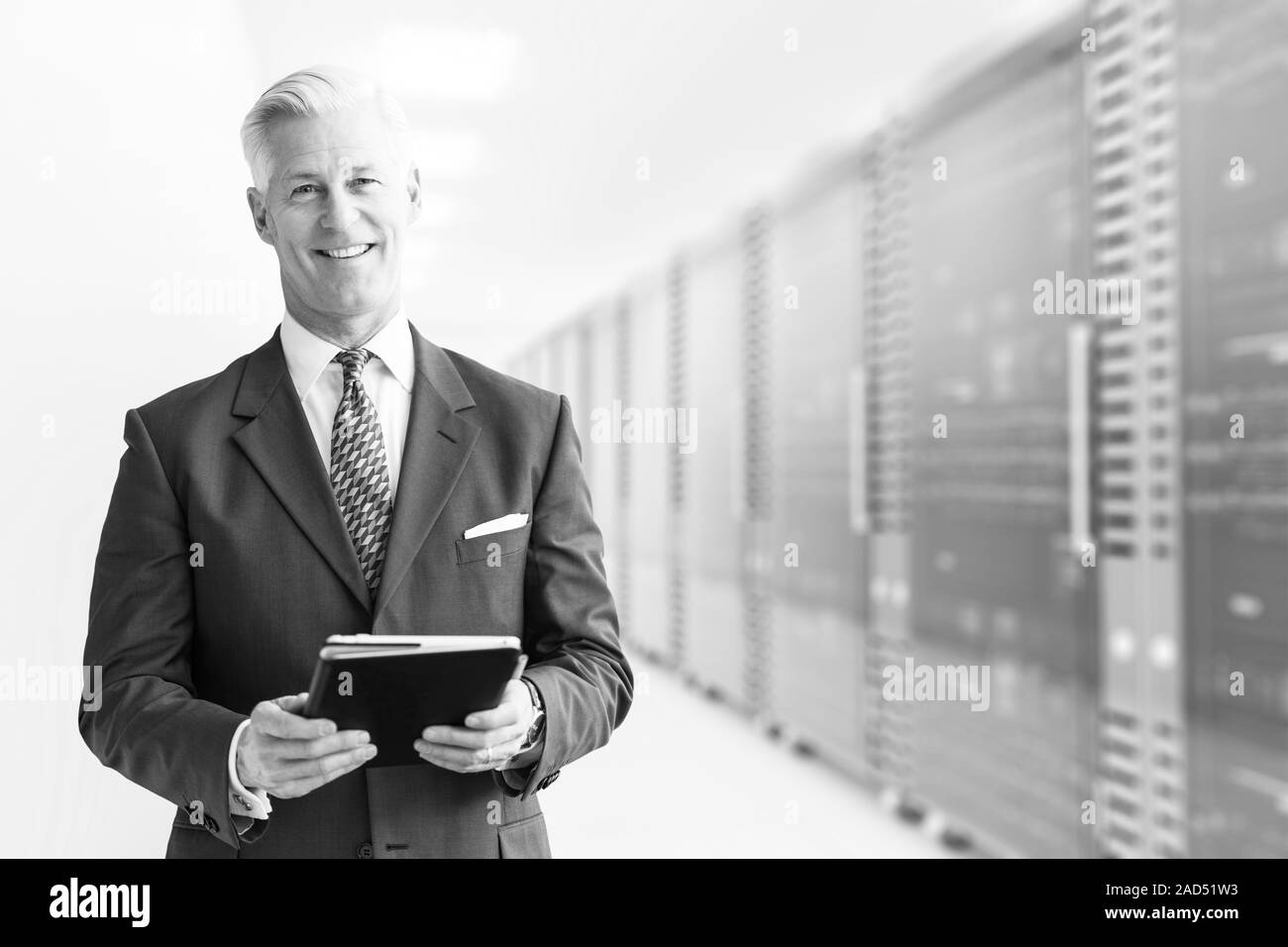 Senior Businessman in server room Stock Photo Alamy