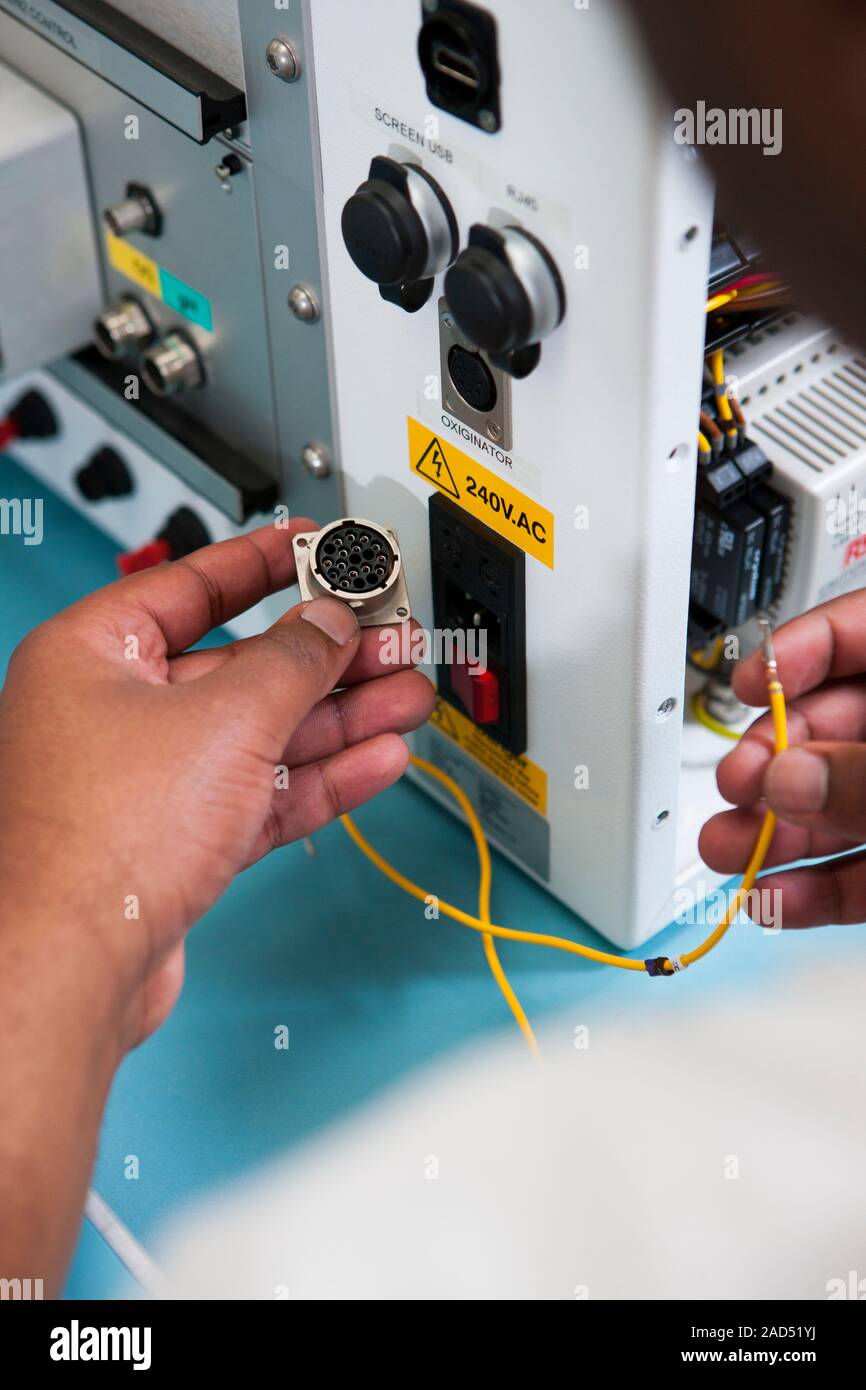 Bioreactor construction. Close-up of a technician building a bioreactor ...