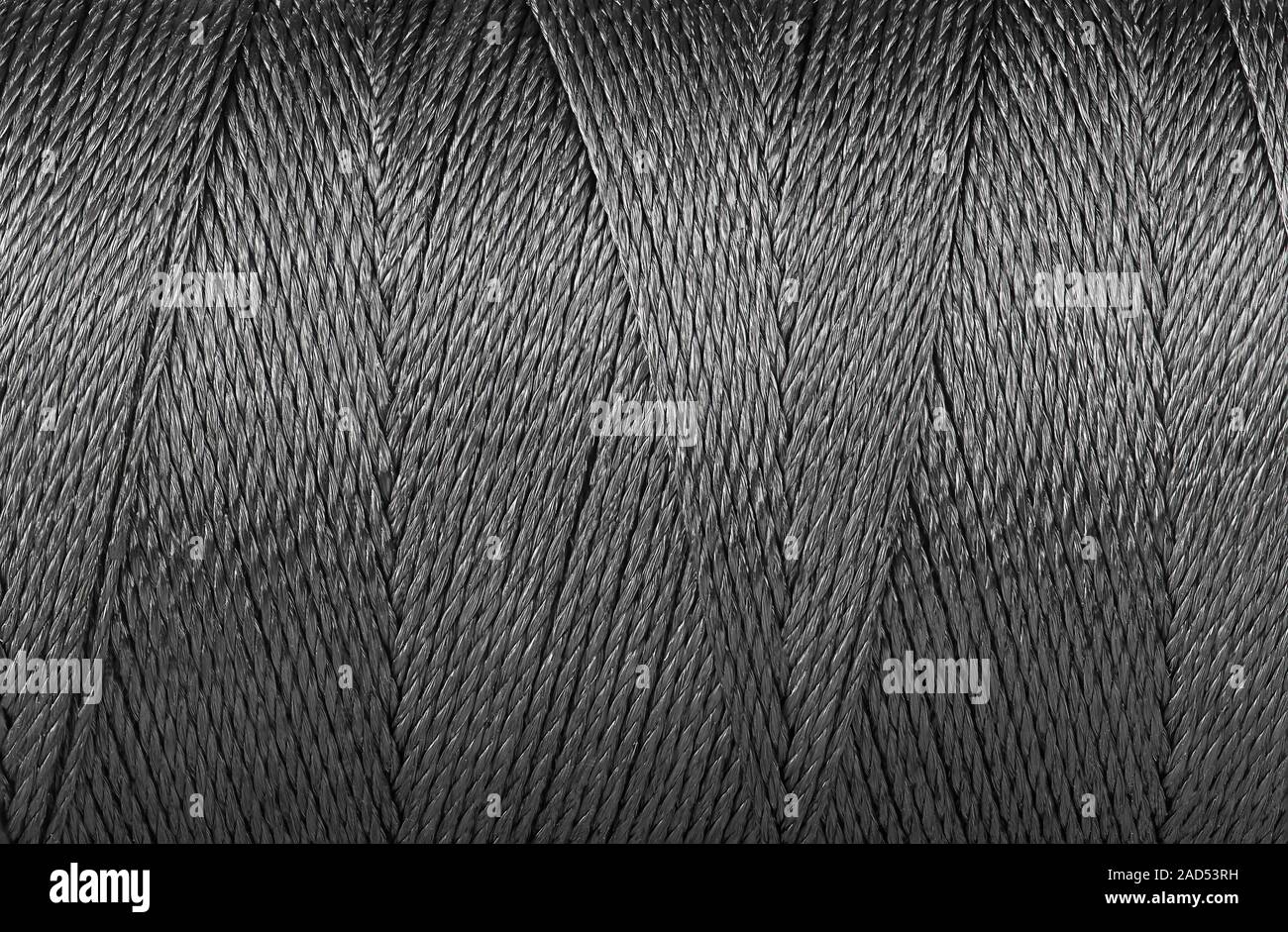 Premium AI Image  Black thread background texture Close up of black thread  for sewing