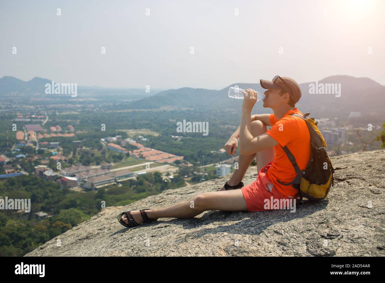 Guy on hill in summer Stock Photo