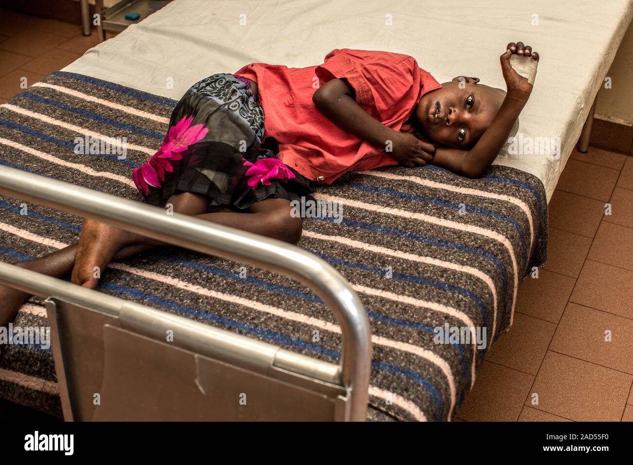 Sick child on a hospital bed. Photographed in St Mary's Hospital, Lacor
