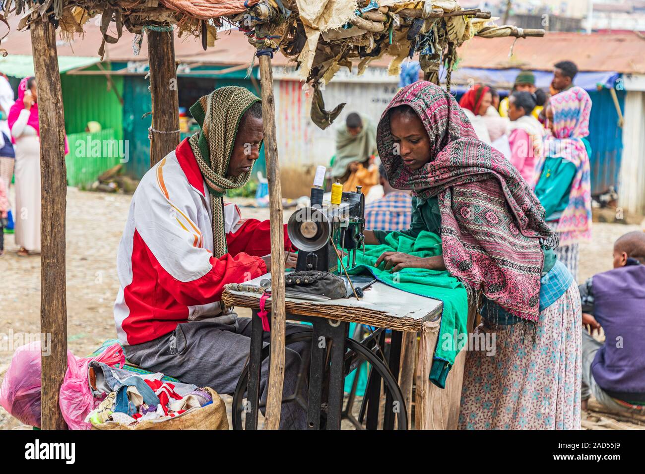 Ethiopia. Amhara. Debark. September 21, 2019. Man mending clothes with