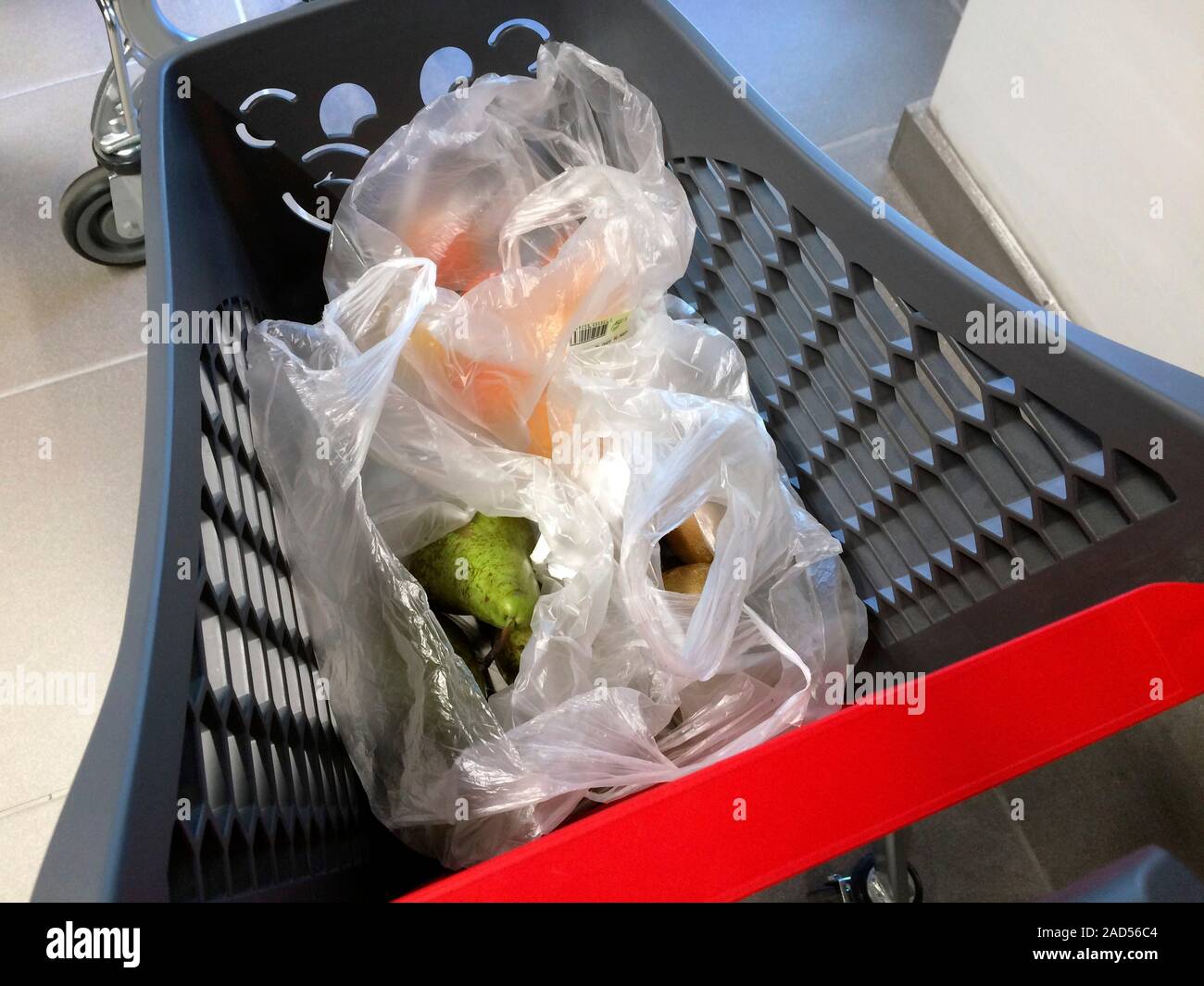 Plastic bag use. Closeup of plastic bags being used to hold groceries