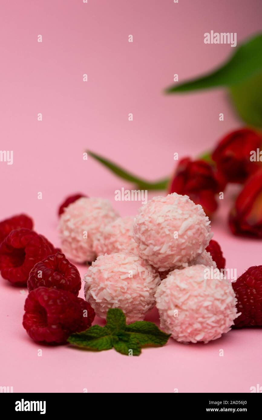 pink coconut candy with raspberries Stock Photo - Alamy