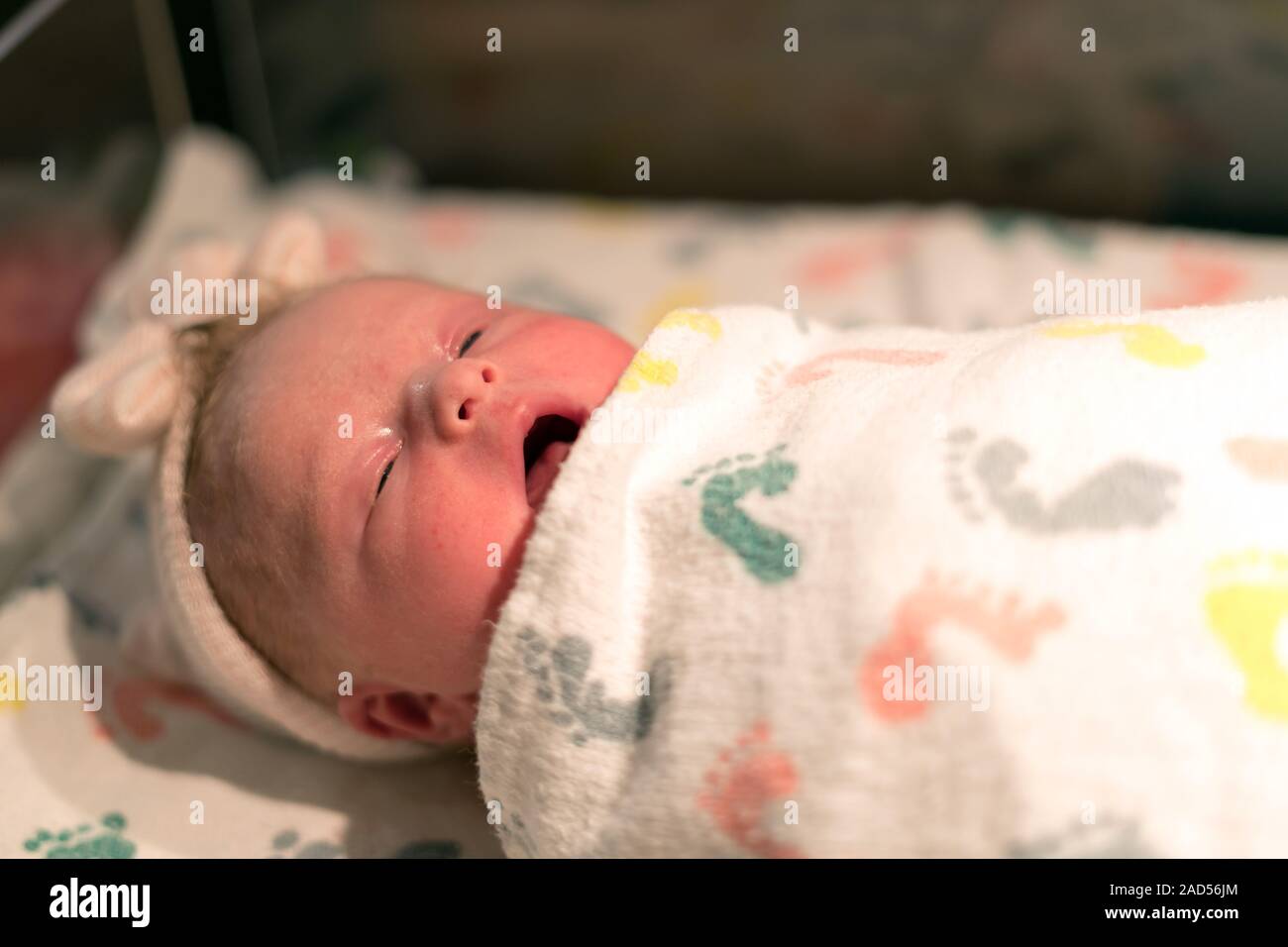 Newborn Baby in Hospital, Sleepy and Yawning Stock Photo