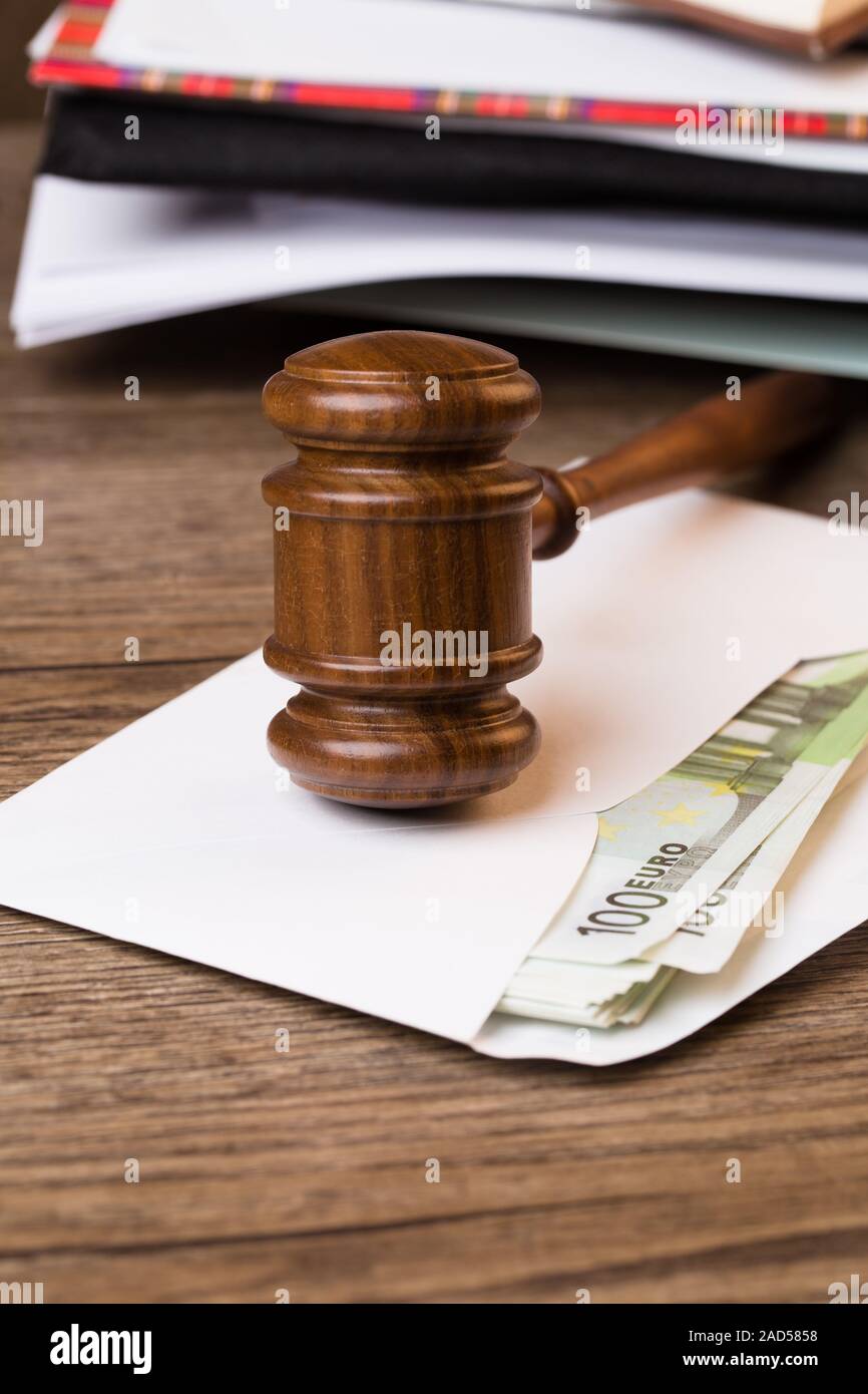 Hammer of judge against folders Stock Photo Alamy
