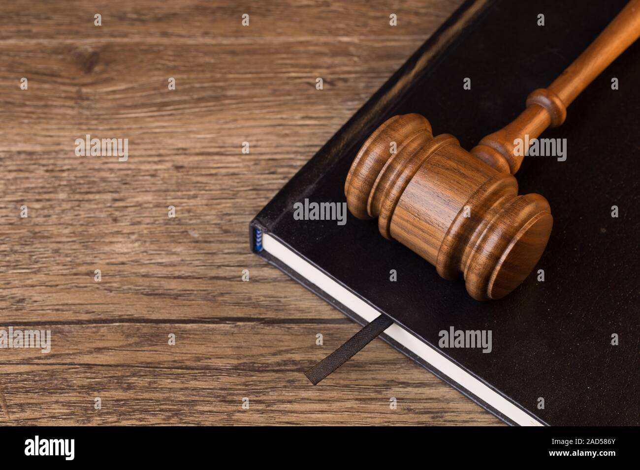 Judge hammer lies on book Stock Photo Alamy