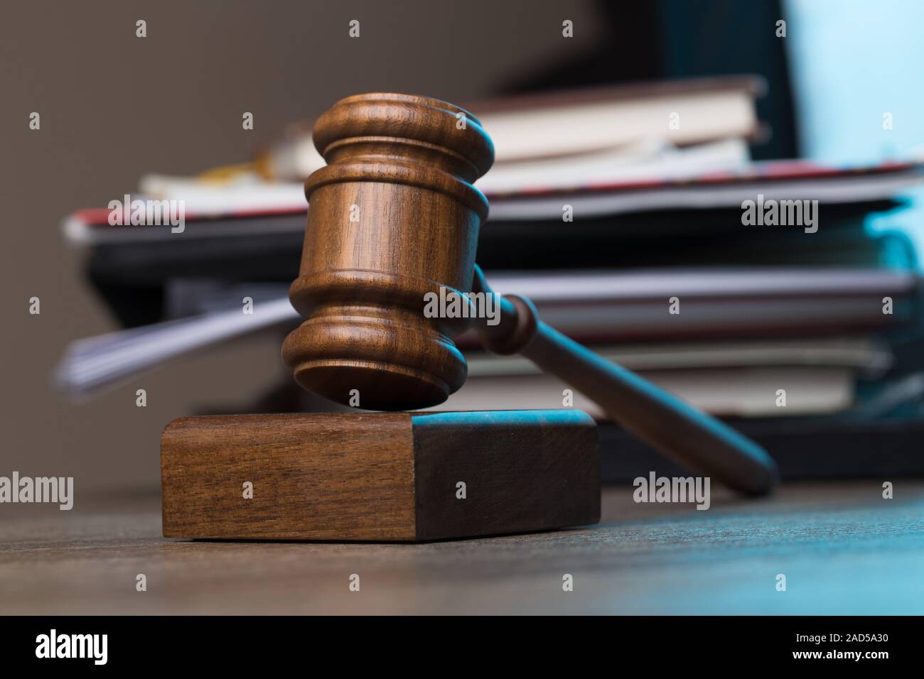 Hammer, paper lies on table Stock Photo