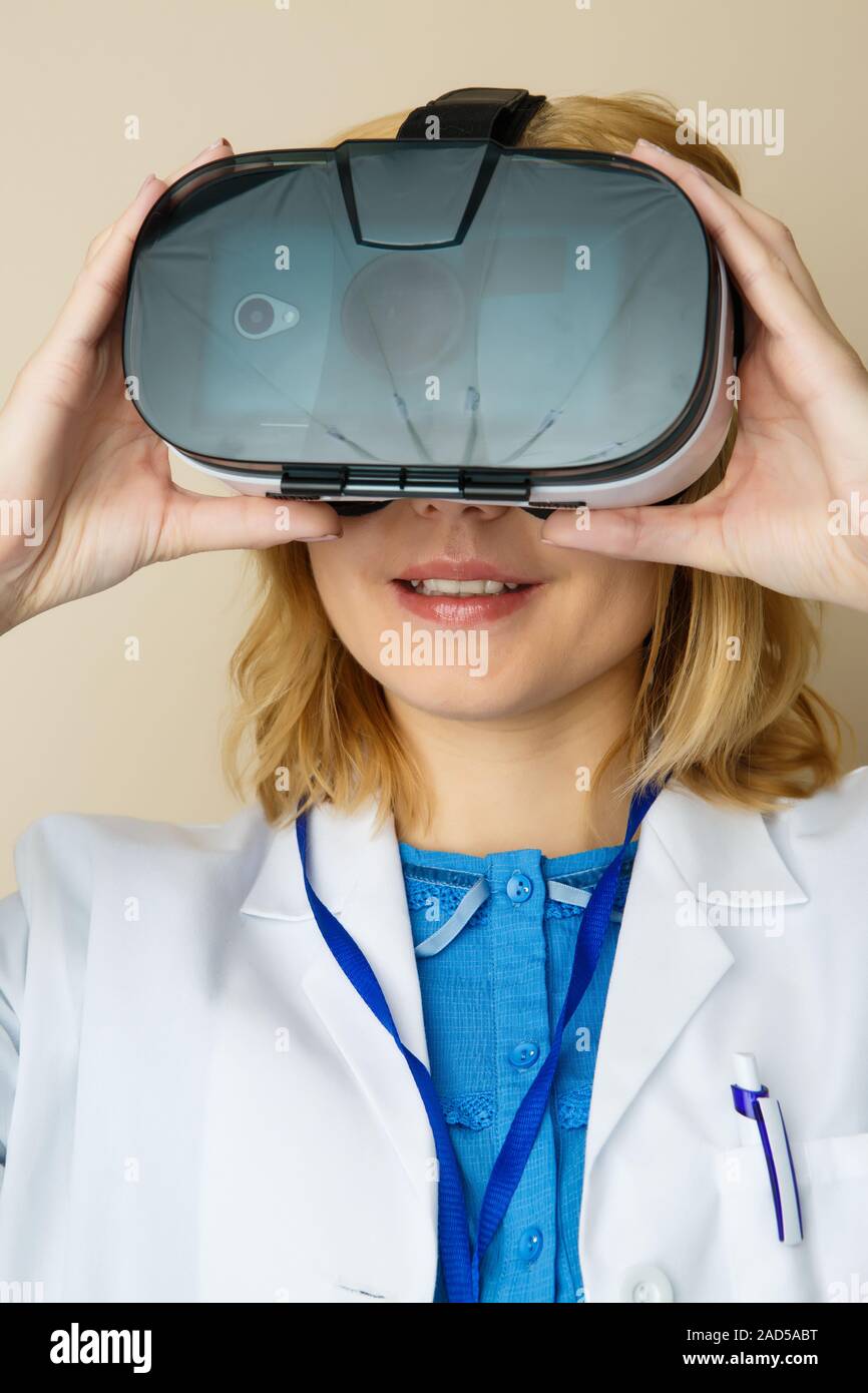 Girl in white lab coat Stock Photo - Alamy