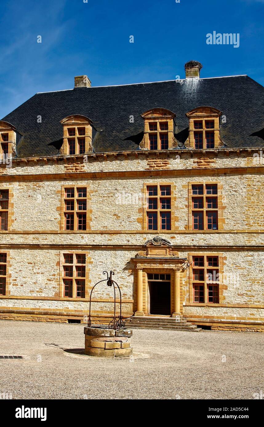 Chateau Courmatin; 17th century castle; ornate entrance, well, courtyard, 3 story, multiple windows, old stone building, Burgundy; Taize; France, summ Stock Photo