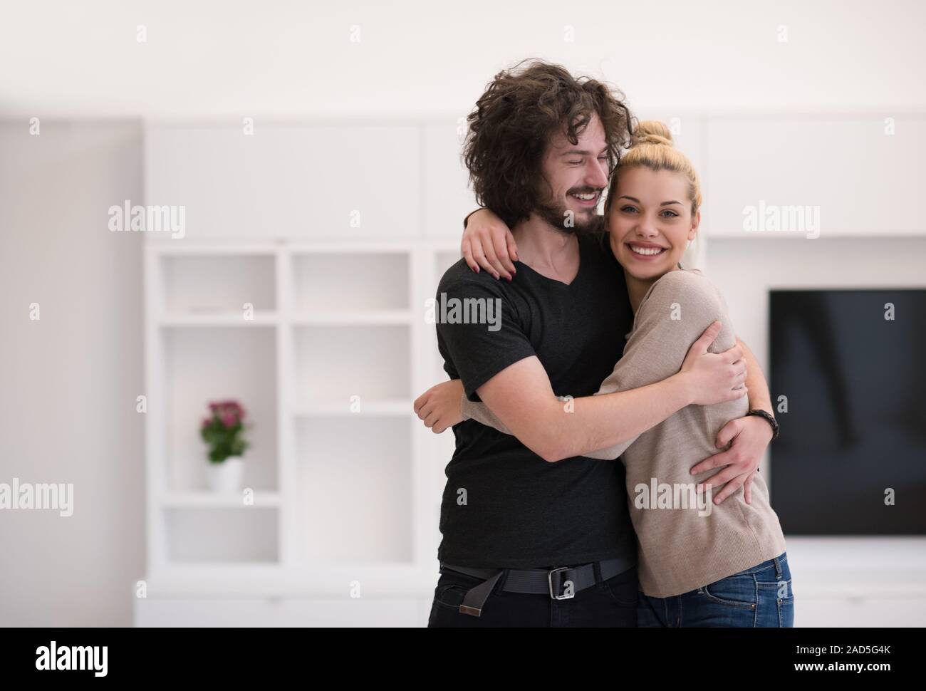 couple hugging in their new home Stock Photo - Alamy
