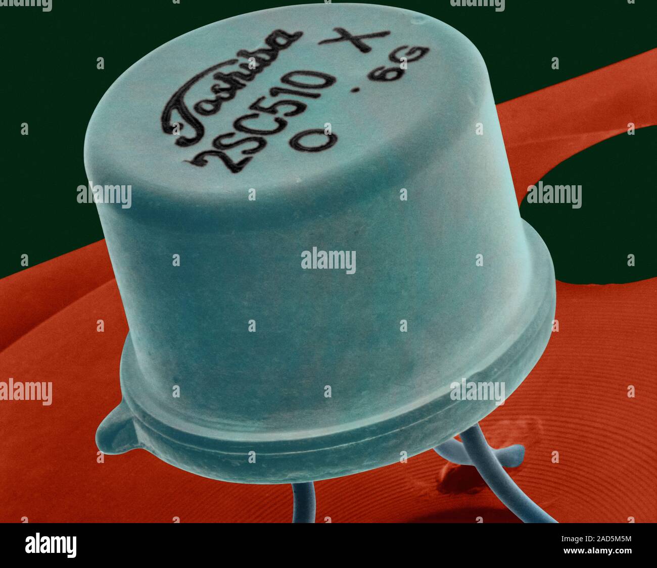 Coloured scanning electron micrograph (SEM) of Small transistor welded ...