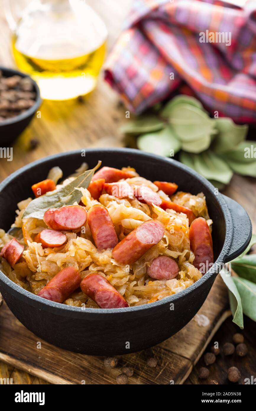 Cabbage braised with sausages, sauerkraut. German cuisine Stock Photo