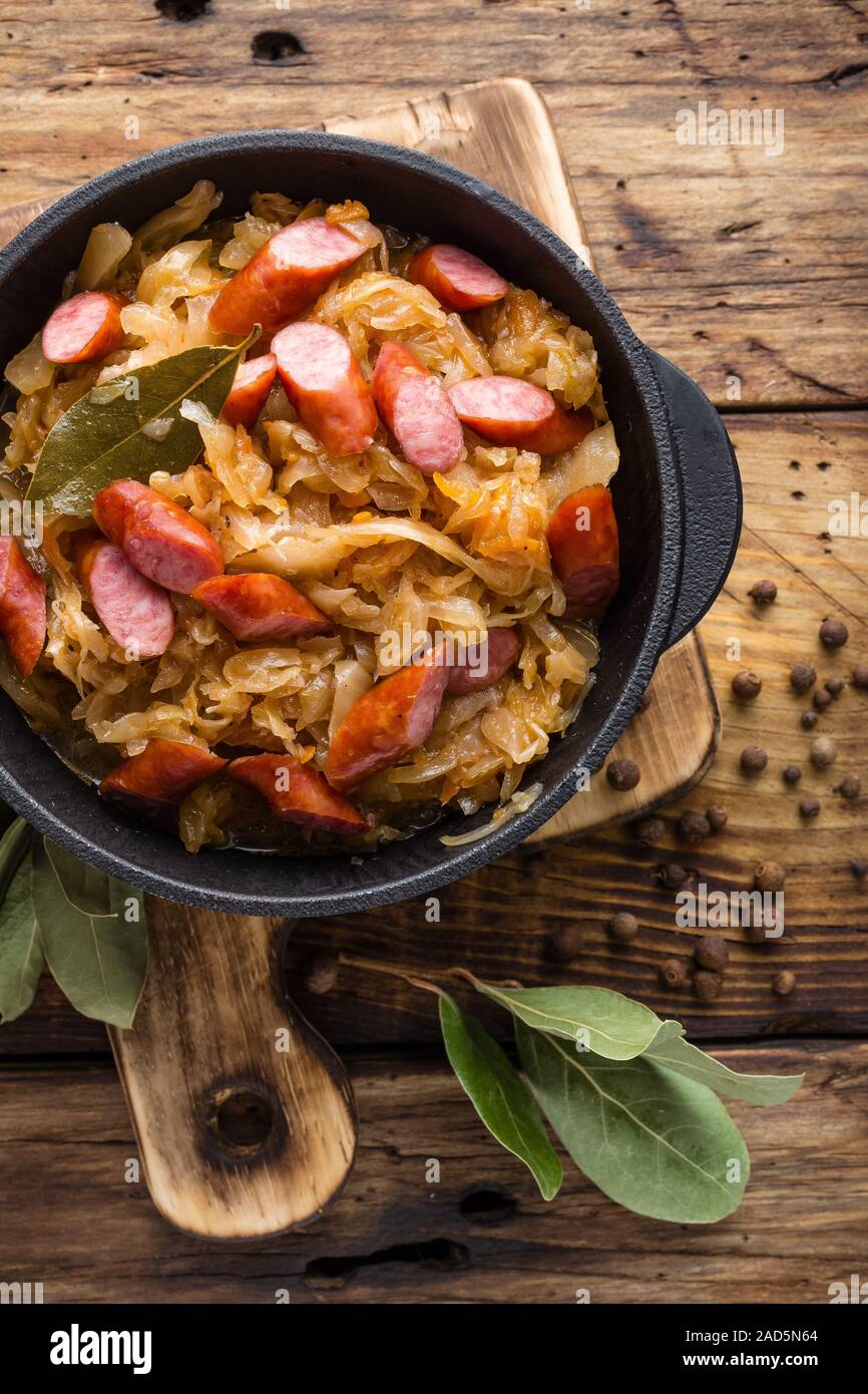Cabbage braised with sausages, sauerkraut. German cuisine Stock Photo
