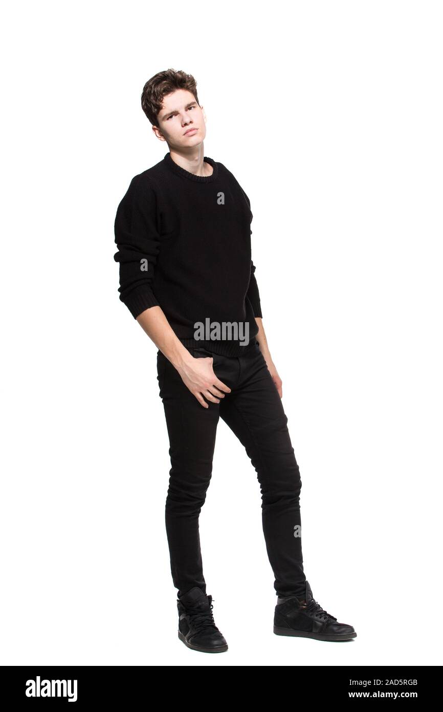 Young Male Model In Black Clothes Posing In Studio White Background Caucasian Guy In Stylish Clothes Sweater And Jeans Isolate Fashion Model Young Stock Photo Alamy