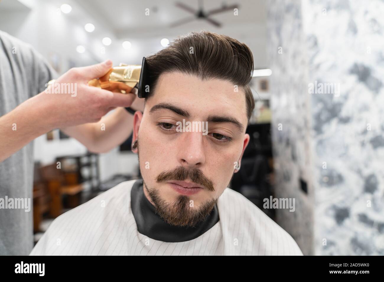 Men's haircut and hair styling. Men's beauty and hair care Stock Photo -  Alamy
