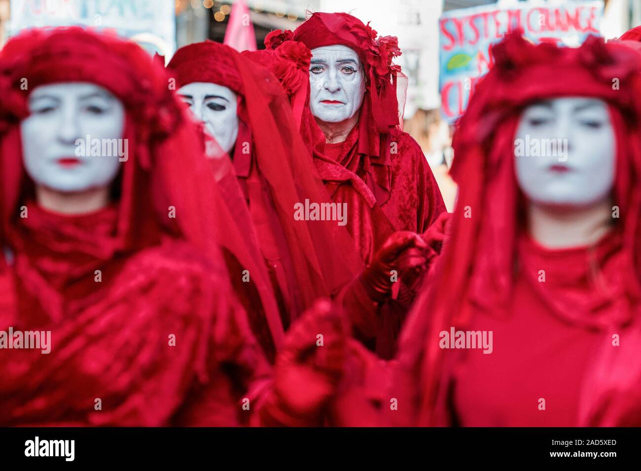 Extinction Rebellion Red Brigade protesters are pictured in Bath as they join students and school children in a climate change protest march. 29-11-19 Stock Photo