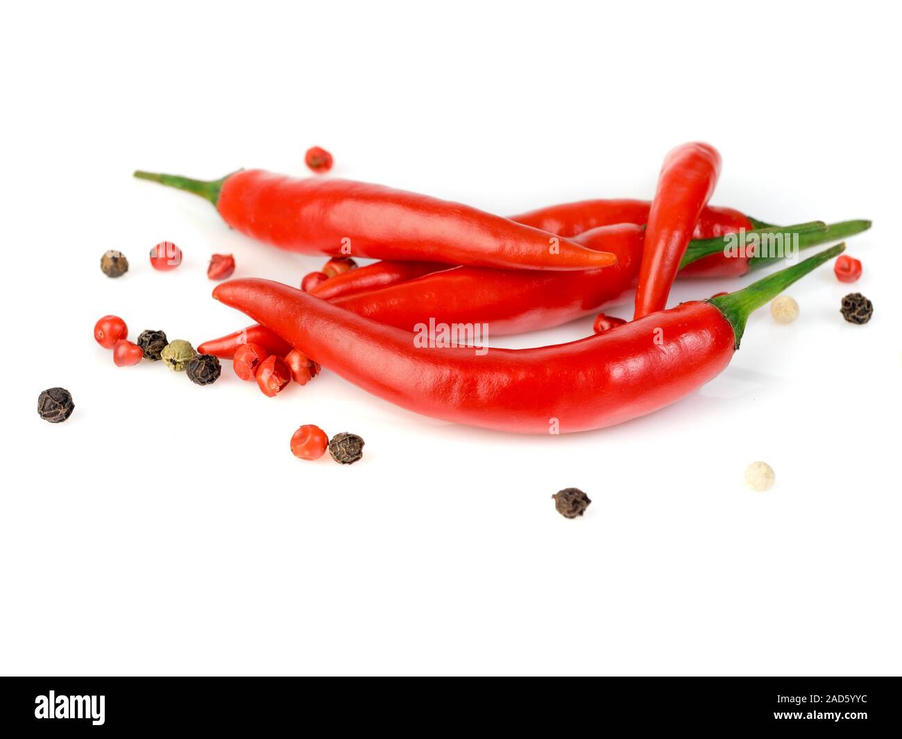 Red cayenne pepper and peppercorn on white background, side view Stock