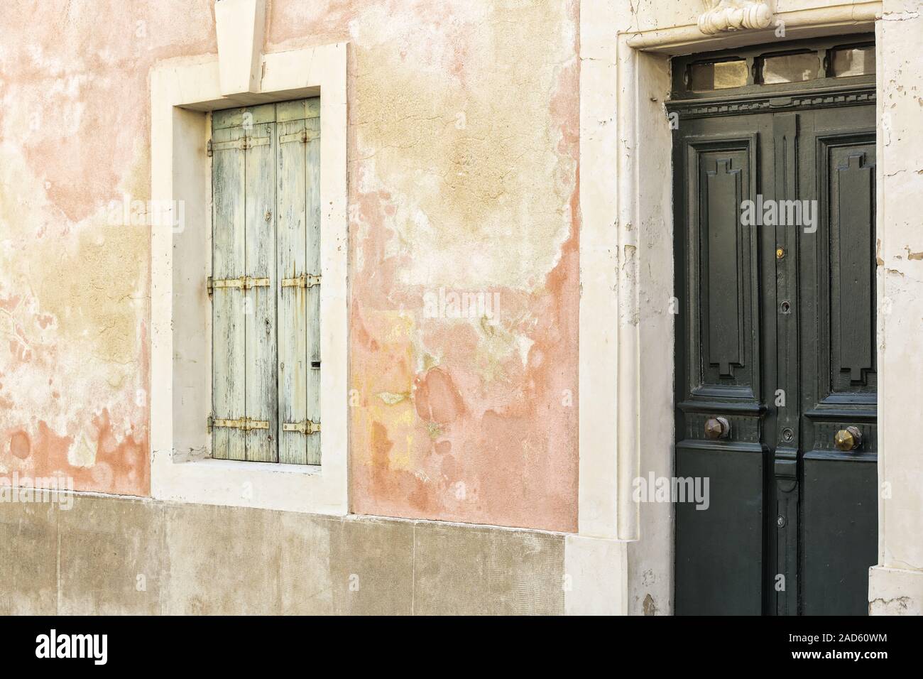 Weathered house wall with window and door, France Stock Photo - Alamy