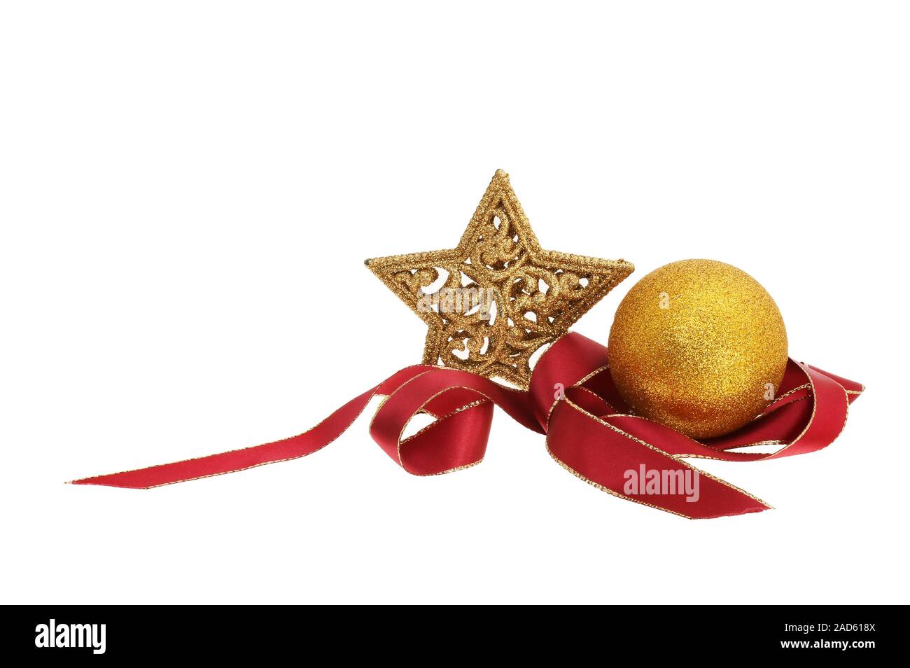 Christmas decoration, gold glitter star and bauble with coiled red and ...