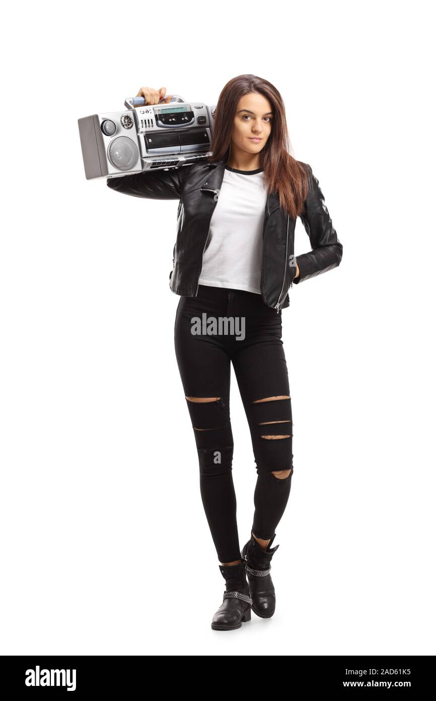 Full length portrait of a young woman holding a boombox on her shoulder isolated on white background Stock Photo