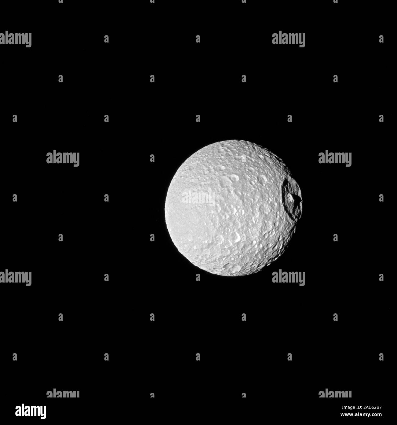 Cassini spacecraft image of Saturn's moon Mimas. At right is the