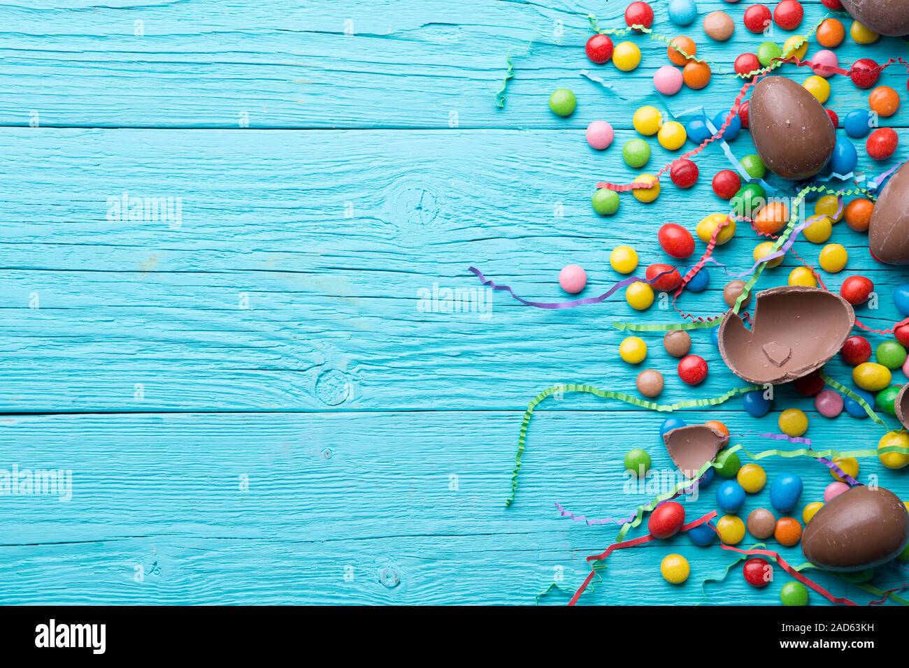 Multi-colored sweets, chocolate eggs, ribbon Stock Photo