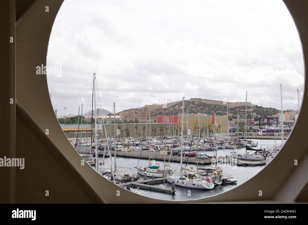 Port hole with view of harbor Stock Photo