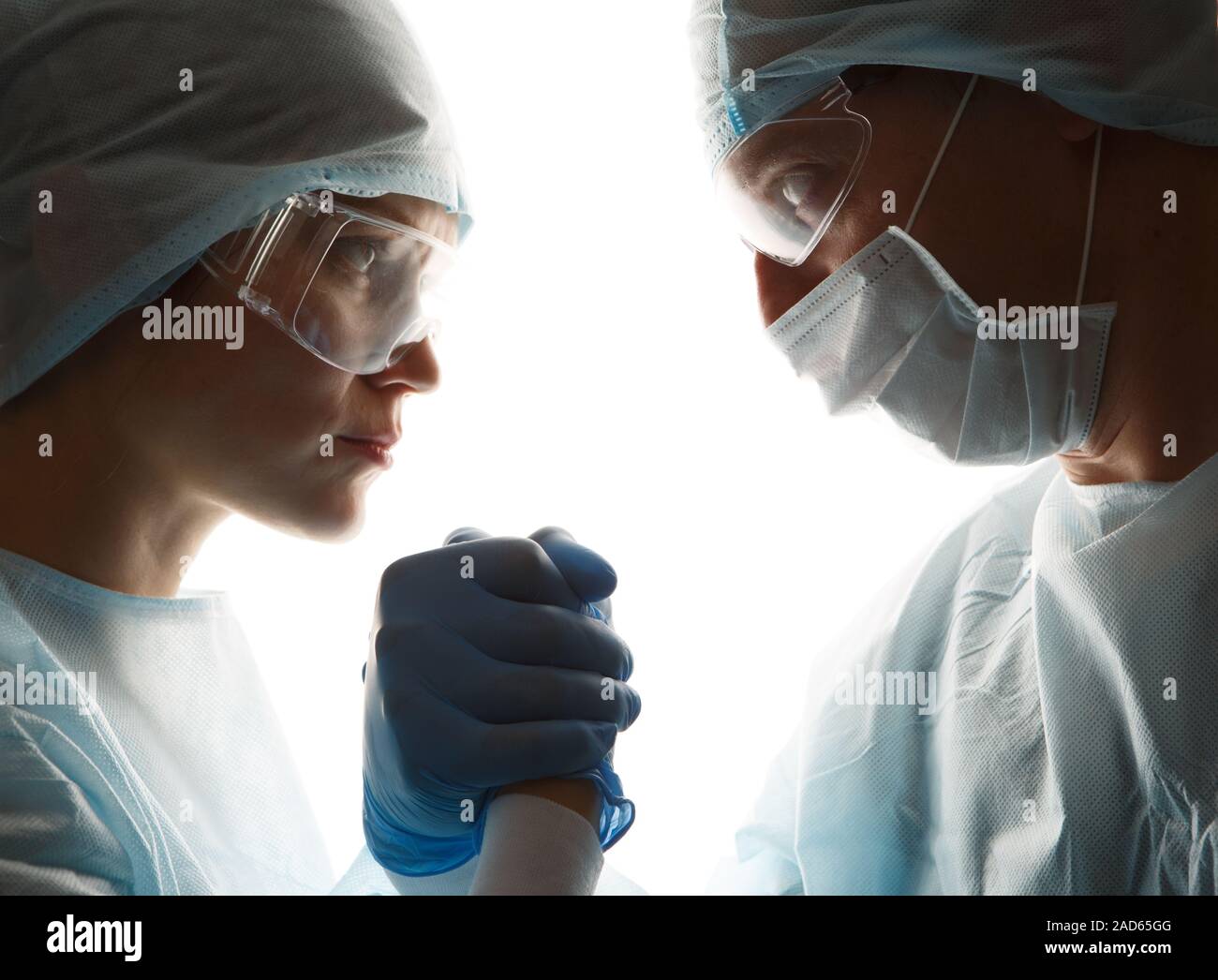 Doctors in gloves make handshake Stock Photo