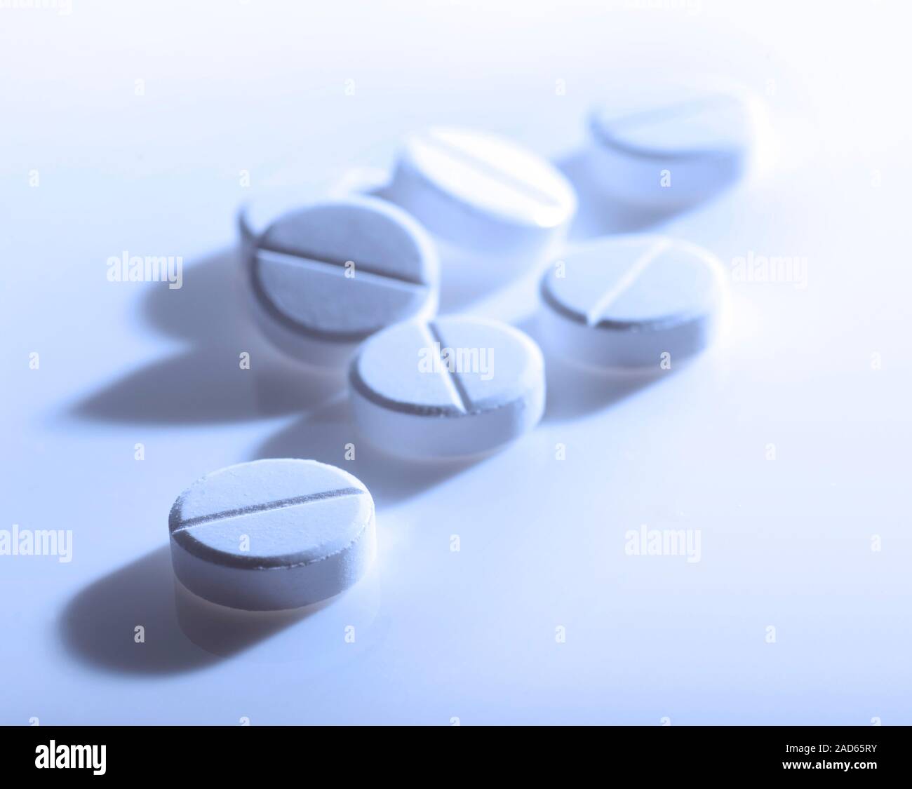 White tablets. These tablets could represent painkillers, such as paracetamol or aspirin. The