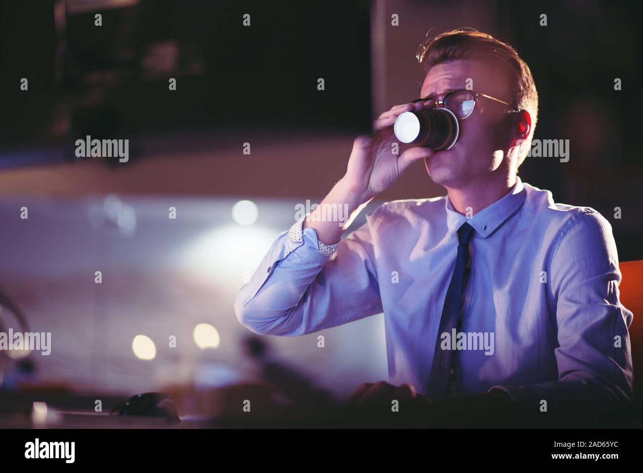 Tired Businessman working late Stock Photo