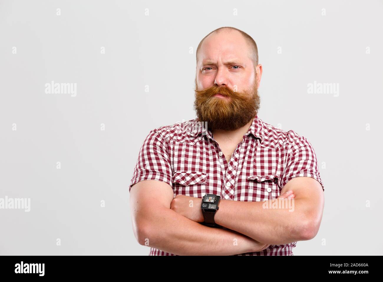 Doubting man with ginger beard Stock Photo