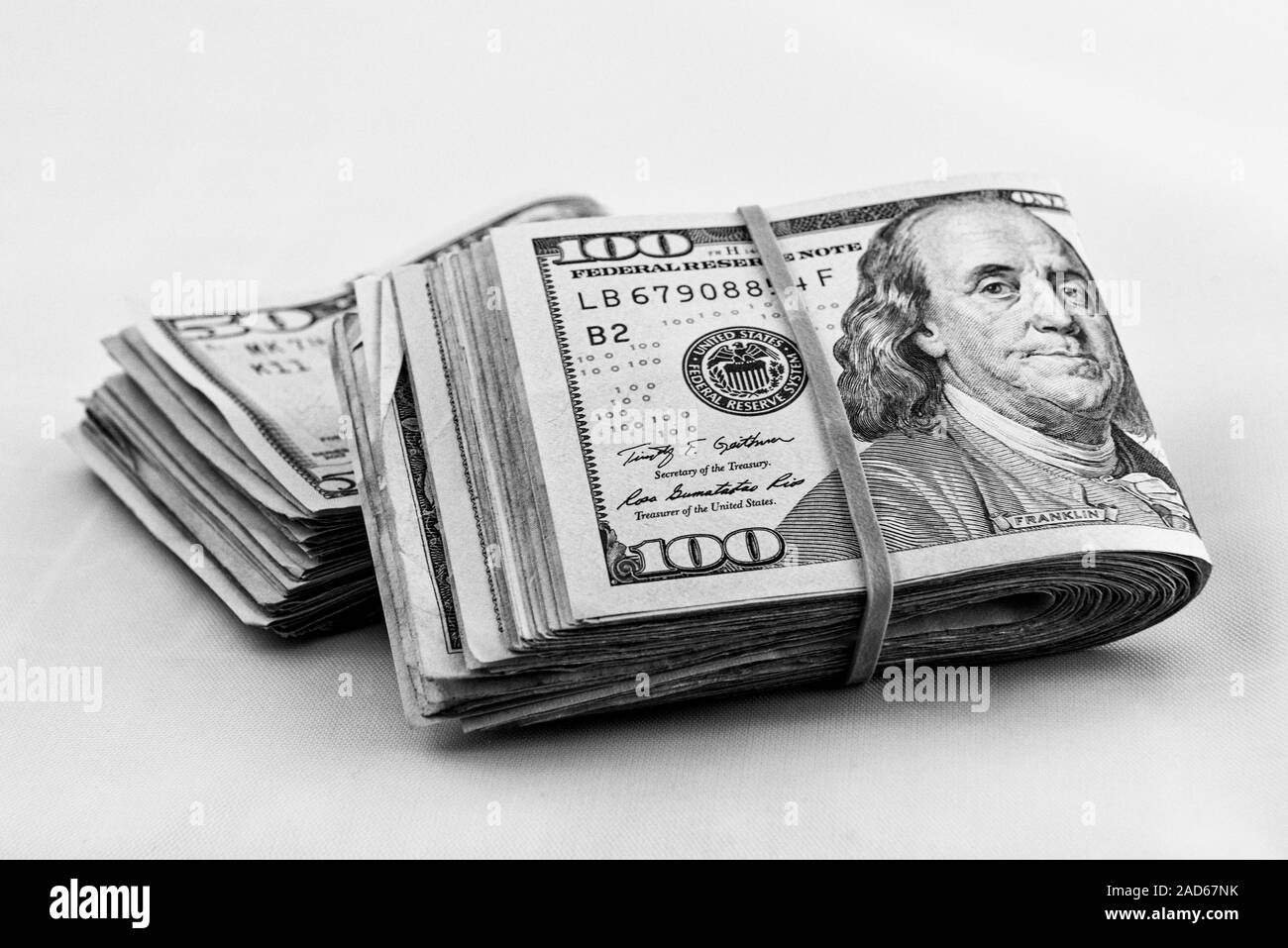 Wads of 100 dollar bills Black and White Stock Photos & Images - Alamy
