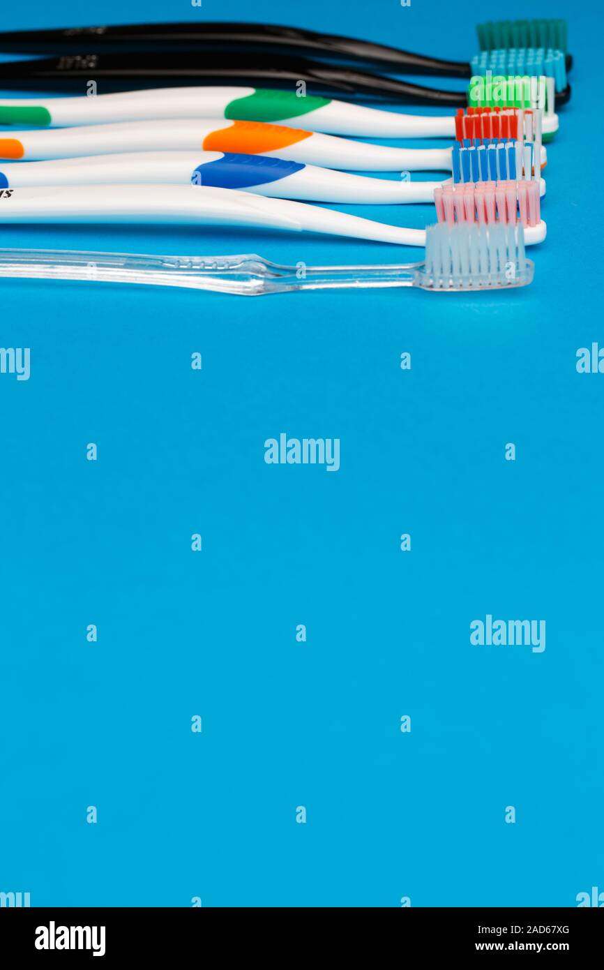 Multi colored toothbrushes on top Stock Photo