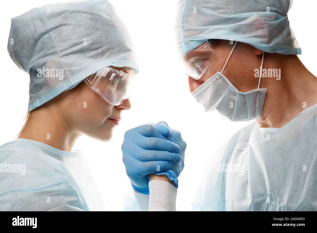 Doctors in uniform make handshake Stock Photo