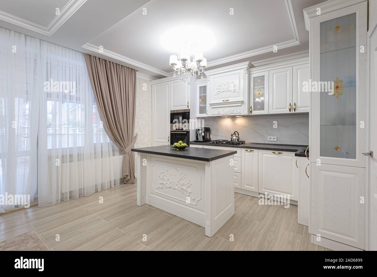 White luxury modern kitchen with island Stock Photo
