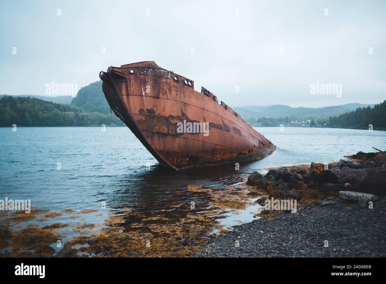 old whaling vessel washed ashore in newfoundland, canada on an overcast day Stock Photo