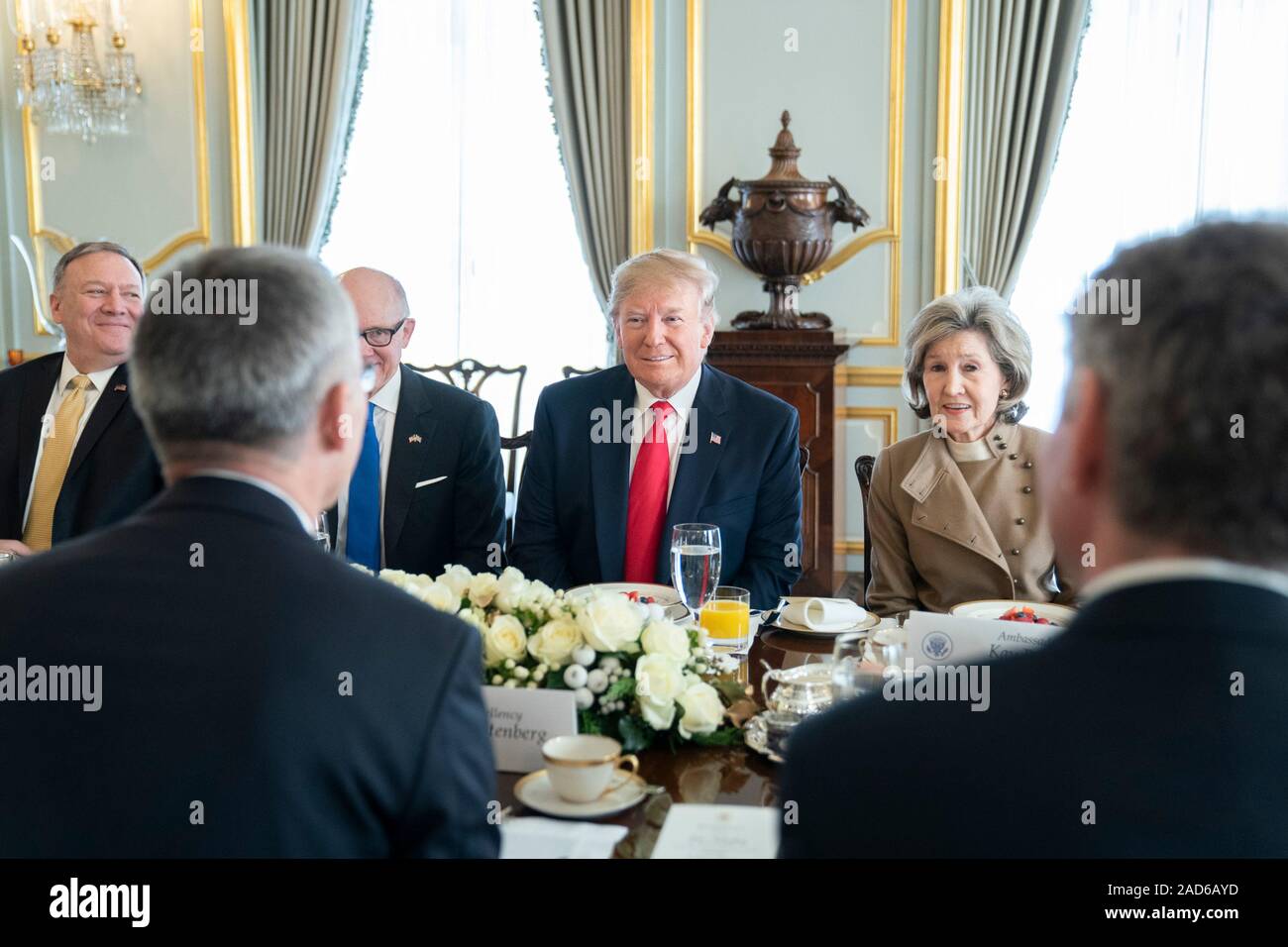 London, UK. 03 December, 2019. U.S. President Donald Trump during a breakfast meeting with NATO Secretary General Jens Stoltenberg before the start of the NATO Summit at Winfield House December 3, 2019 in London, UK. Joining the President is Secretary of State Mike Pompeo, left, Ambassador to Great Britain Woody Johnson, and Ambassador to NATO Kay Bailey Hutchison, right.     Credit: Shealah Craighead/Planetpix/Alamy Live News Stock Photo