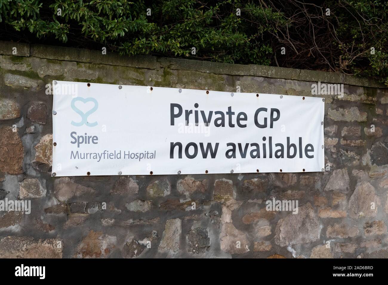 Private GP now available banner sign outside Spire Murrayfield Hospital, Edinburgh, Scotland, UK Stock Photo